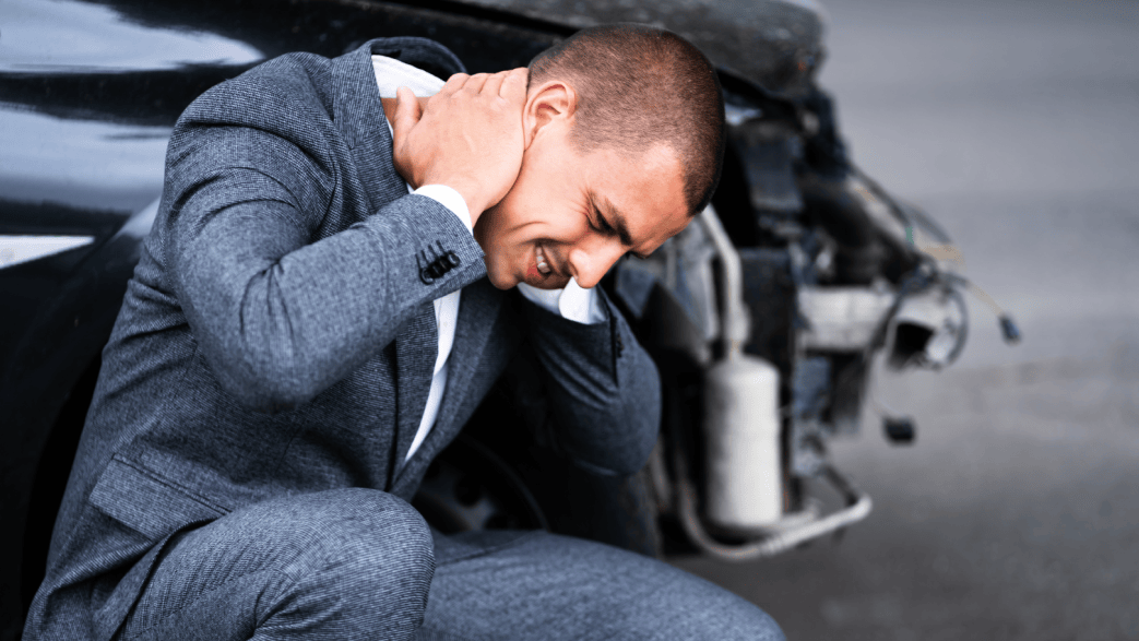 Picture of a person with neck pain due to a work-related injury